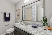 Bright bathroom with granite counters