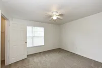Bedroom with carpet & ceiling fan