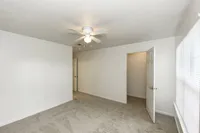 Bedroom with carpet & ceiling fan
