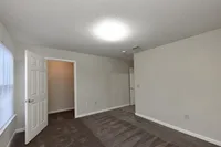 Bedroom with carpet & overhead lighting