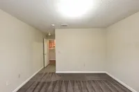 Bedroom with carpet & overhead lighting