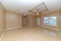 Living room and dining area with built-in lighting