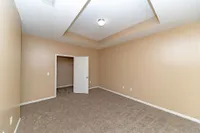 Bedroom with carpet and generous closet space