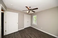Bedroom with hardwood-style flooring