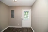 Entry way with hardwood-style flooring