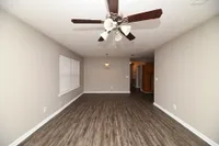 Spacious living room with hardwood-style flooring