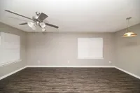 Spacious living room with hardwood-style flooring