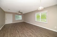 Spacious living room with hardwood-style flooring