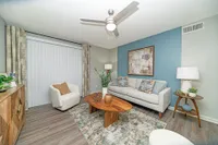 Spacious living room with hardwood-style flooring