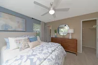 Cozy bedroom with carpet & ceiling fan