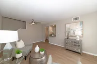 Spacious living room with hardwood-style flooring
