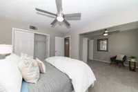 Cozy bedroom with carpet & ceiling fan