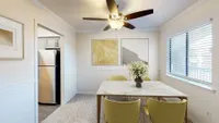 Dining area with carpet & overhead lighting