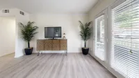 Spacious living room with hardwood-style flooring