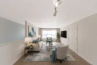 Spacious living room with carpet