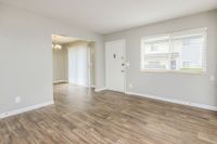 Spacious living room with hardwood-style flooring