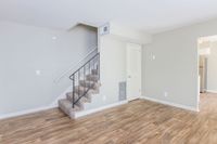 Spacious living room with hardwood-style flooring