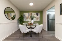 Dining area with hardwood-style flooring & overhead lighting