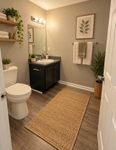 Bright bathroom with hardwood-style flooring