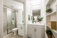 En suite bathroom with additional sink and vanity