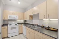 Kitchen with undercabinet lighting and plenty of space for all small appliances