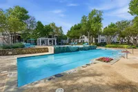 Community pool over looking waterfall and gazebo