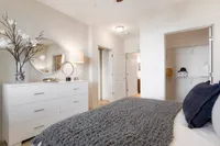 Spacious walk-in closet with organized shelving, perfect for storage and maximizing space.