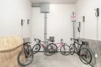 Modern apartment bicycle storage with sleek racks and multiple bike options, ideal for cycling enthusiasts.