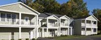 Panoramic image of the front of a green Kensington apartment building