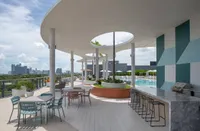 Two grilling stations with bar and tabletop seating