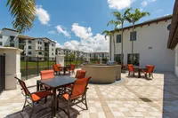 Lakeside outdoor living room with grilling stations