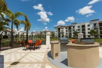 Lakeside outdoor living room with grilling stations