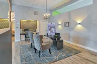 Sophisticated office space with elegant seating, modern lighting, and stylish decor accents.