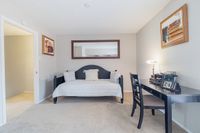 Cozy home office space with a chic daybed, elegant desk, and stylish decor, ideal for productivity and relaxation.
