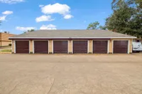 Charming multi-unit garage facility with vibrant doors, ideal for secure parking and storage.