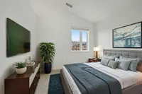 Elegant bedroom with vaulted ceilings and plenty of natural sunlight!