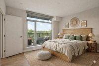 Inviting bedroom with large windows overlooking a lush green view, featuring elegant decor, a cozy bed, and access to a serene balcony.
