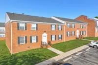 Two-story red brick apartment buildings