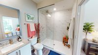 Walk-in shower with waterfall shower head