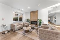 Inviting lounge area with cozy seating, stylish marble tables, and a modern fireplace, perfect for relaxation and entertaining.