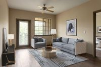 Chic living room with modern gray sofa, stylish armchair, abstract art, and large windows.