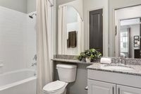 Experience modern elegance in this beautifully designed bathroom space.