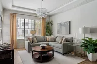 Step into this elegantly designed living room, where comfort meets chic modernity.