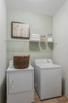 Experience the charm of this efficiently organized laundry room, blending style and practicality.