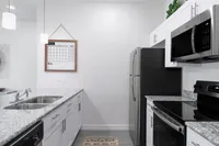 Explore this sleek and stylish kitchen designed for both function and elegance.