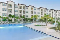 Experience modern living with this beautiful apartment complex featuring a stunning poolside view.