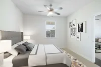 Relax in this elegant bedroom retreat, where modern style meets cozy comfort.