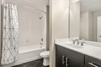 Bathroom with tub and sink