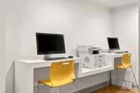 Community office space with computers and printer