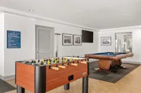 Indoor community area with pool and foosball